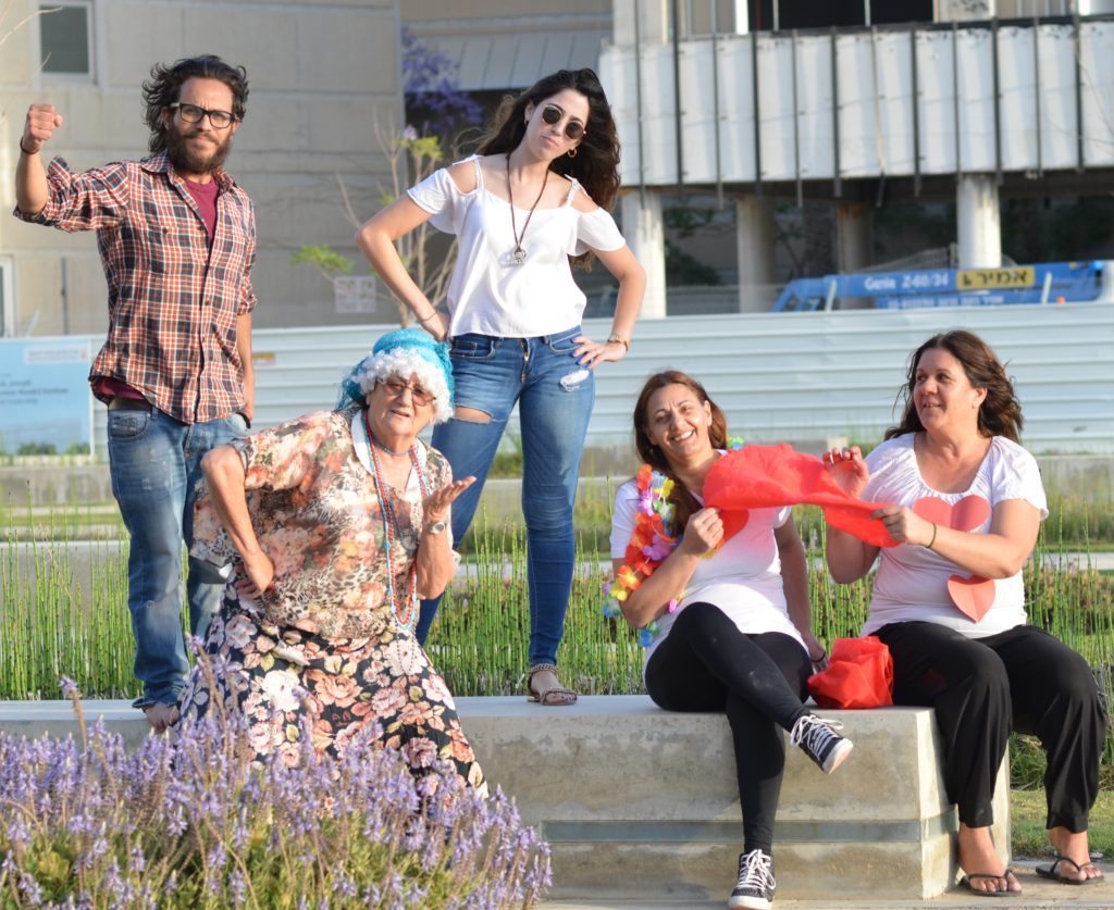 Goodman fellow Husan Ziyud (left) with members of his community theatre group and other neighborhood residents.