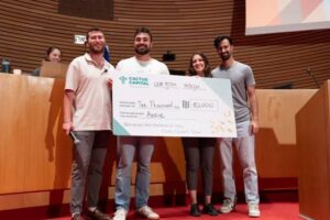 THE ANNIE founding team receiving an investment check from Cactus Capital